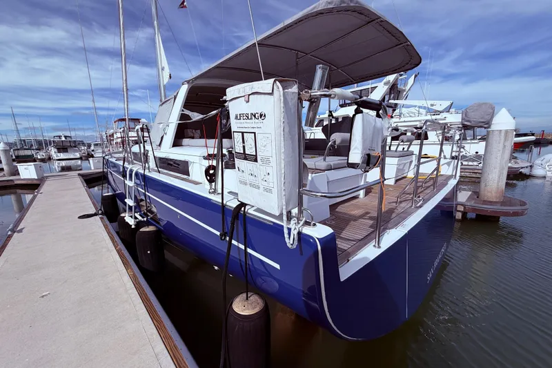 Slide: The Image of 2022 Beneteau Oceanis Yacht 54 docked, showcasing sleek design and modern features. - 7