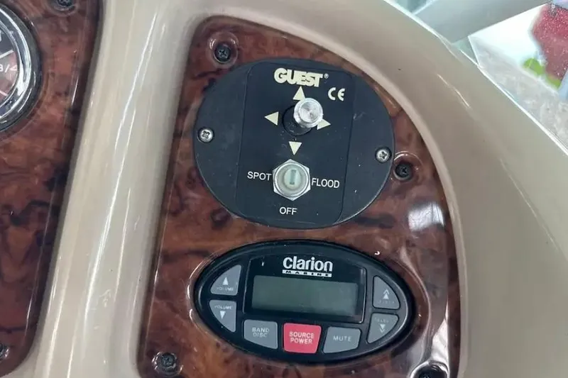 Slide: The Image of Control panel of a 2004 Sea Ray 260 Sundancer boat with Clarion audio system. - 27