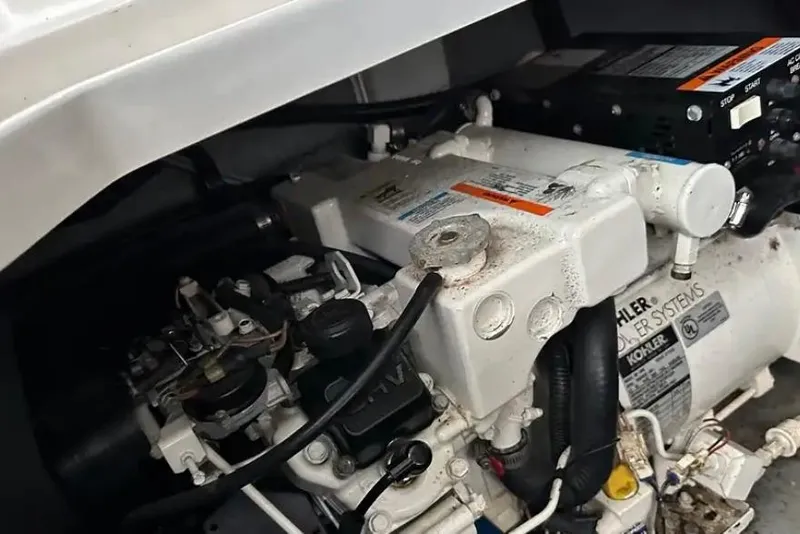 Slide: The Image of Engine compartment of a 2004 Sea Ray 260 Sundancer boat, featuring Kohler power systems. - 41