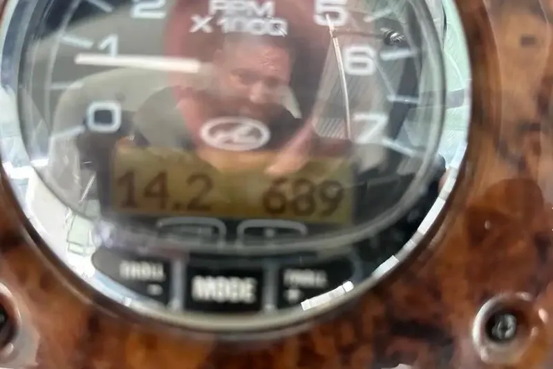 Slide: The Image of Close-up of a 2004 Sea Ray 260 Sundancer boat dashboard gauge. - 46