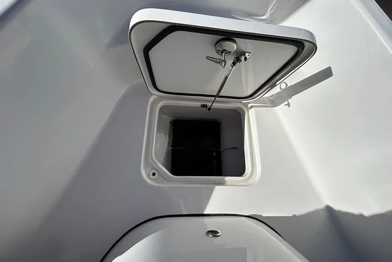 Slide: The Image of 2026 Sea Pro 210 Bay boat storage compartment with open hatch. - 11