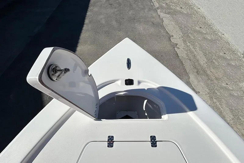 Slide: The Image of 2026 Sea Pro 210 Bay boat with open storage compartment on deck. - 17