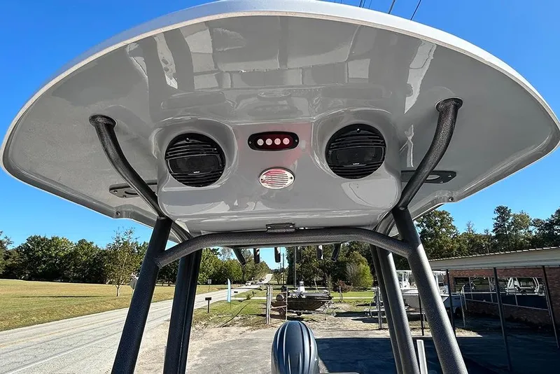 Slide: The Image of 2026 Sea Pro 210 Bay boat T-top with speakers and lights, outdoor setting. - 35