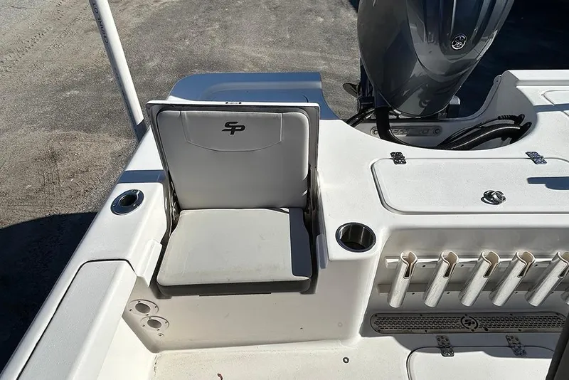 Slide: The Image of 2026 Sea Pro 210 Bay boat interior with seating and rod holders. - 37