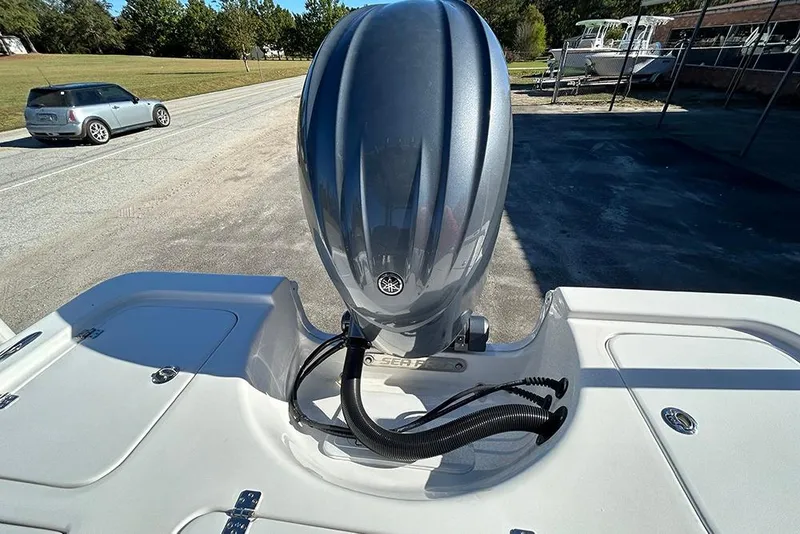 Slide: The Image of 2026 Sea Pro 210 Bay boat with Yamaha outboard motor, parked on a sunny day. - 48