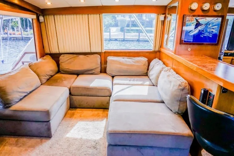 Slide: The Image of Luxurious interior of 1987 Bertram 54 Convertible yacht with plush seating and elegant decor. - 9