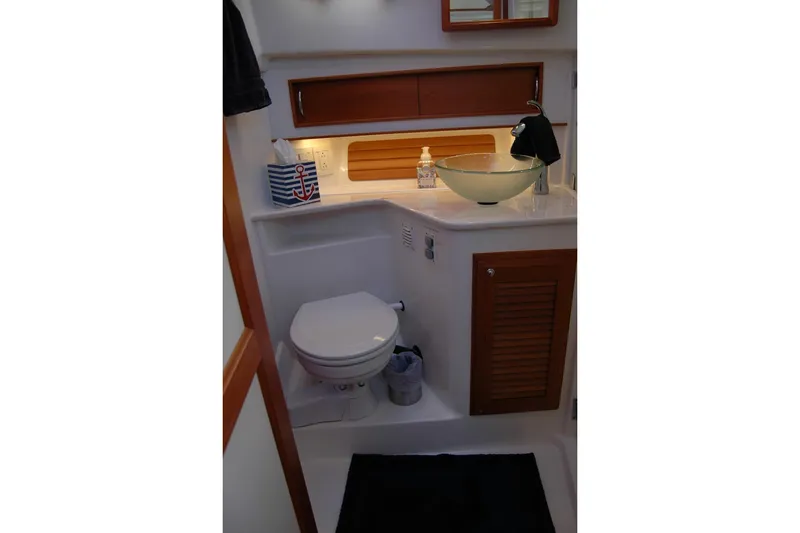 Slide: The Image of 2019 Sabre 38 Salon Express bathroom with modern sink and toilet. - 100