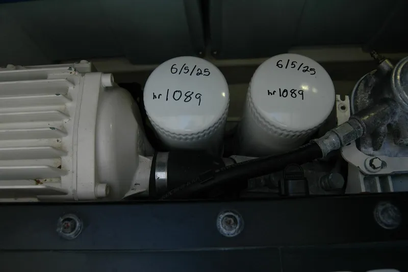 Slide: The Image of Engine components of 2019 Sabre 38 Salon Express with labeled filters, showing maintenance details. - 113