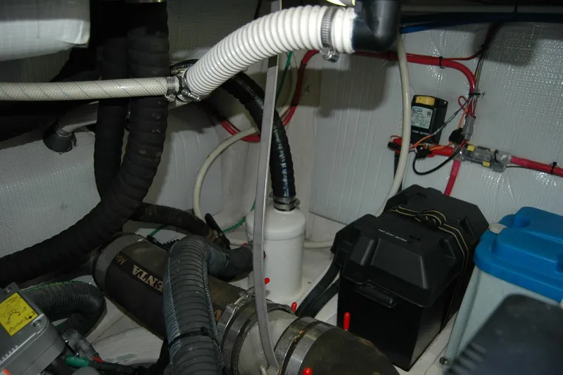 Slide: The Image of Engine room of 2019 Sabre 38 Salon Express with various hoses and equipment. - 114