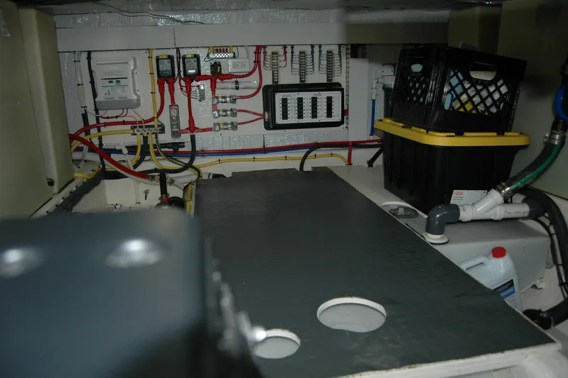 Slide: The Image of Engine room of 2019 Sabre 38 Salon Express with wiring and storage crates. - 117