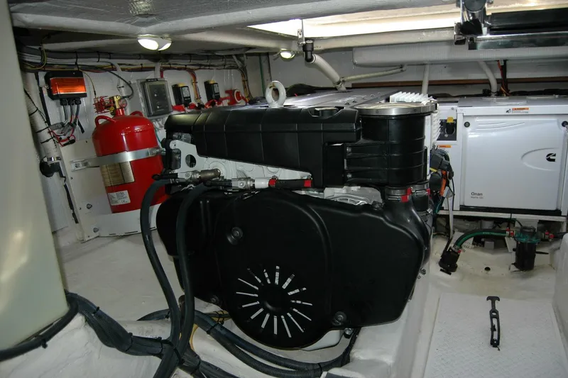 Slide: The Image of Engine room of 2019 Sabre 38 Salon Express with visible machinery and fire extinguisher. - 126