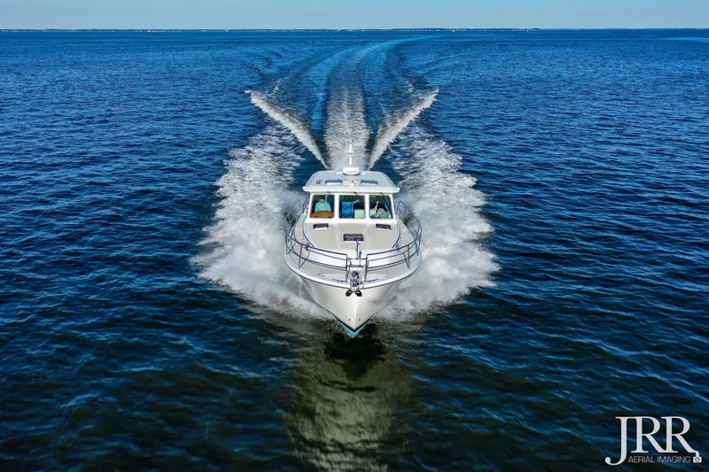 Slide: The Image of 2019 Sabre 38 Salon Express cruising on open water, aerial view. - 20