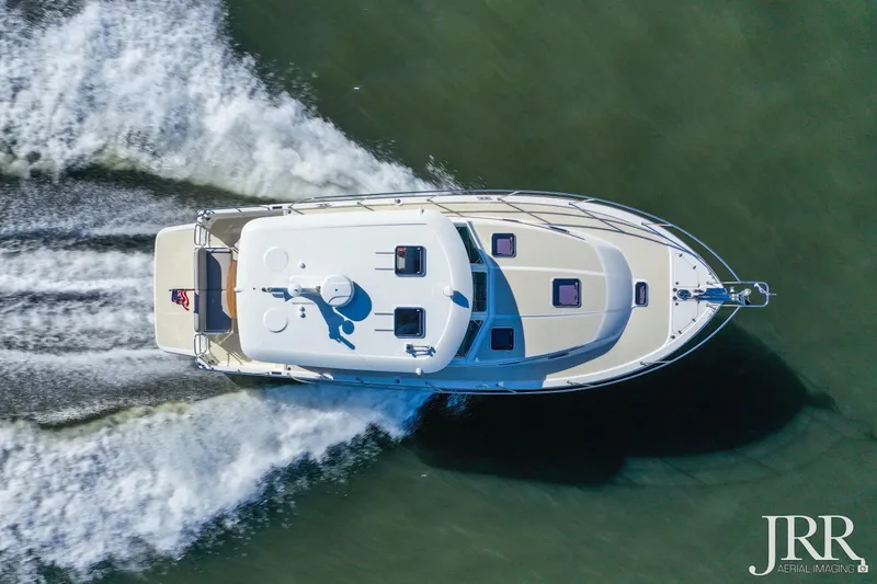 Slide: The Image of Aerial view of 2019 Sabre 38 Salon Express cruising on water. - 22