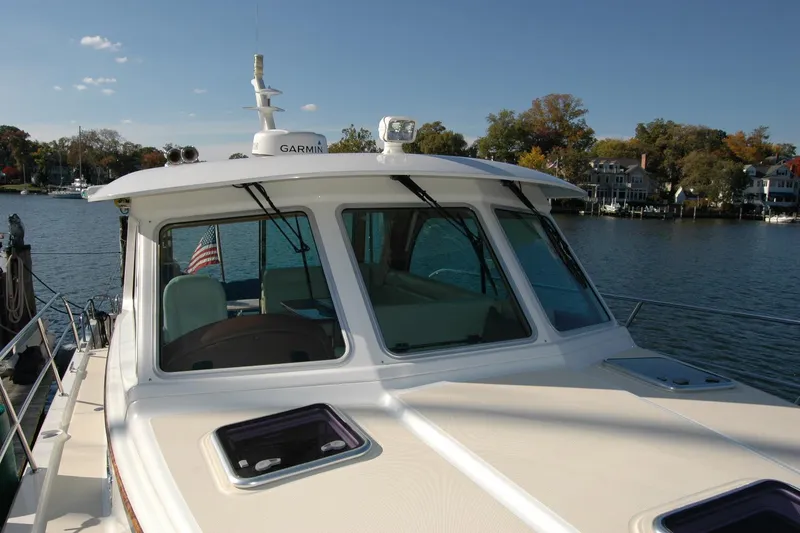 Slide: The Image of 2019 Sabre 38 Salon Express yacht on calm water, showcasing sleek design and modern features. - 31