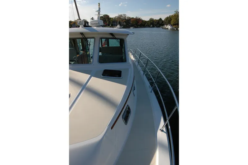Slide: The Image of 2019 Sabre 38 Salon Express yacht on calm water, side view. - 34