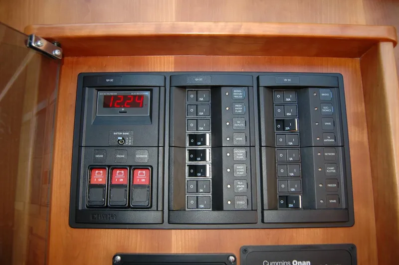 Slide: The Image of Electrical panel of 2019 Sabre 38 Salon Express yacht, featuring switches and voltage display. - 71