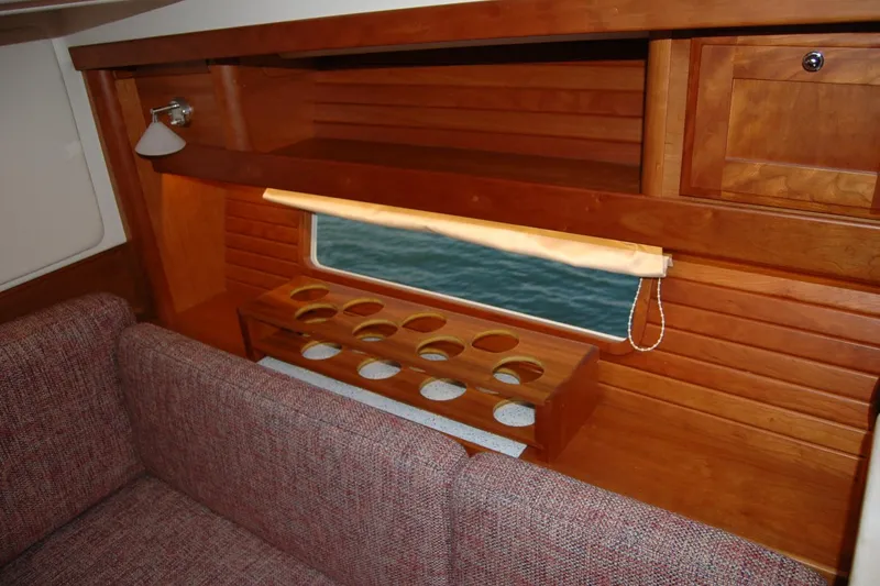 Slide: The Image of Interior of 2019 Sabre 38 Salon Express with wooden cabinetry and seating. - 78