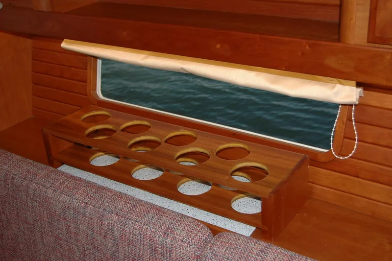 Slide: The Image of Interior of 2019 Sabre 38 Salon Express with wooden cup holder and window view. - 79