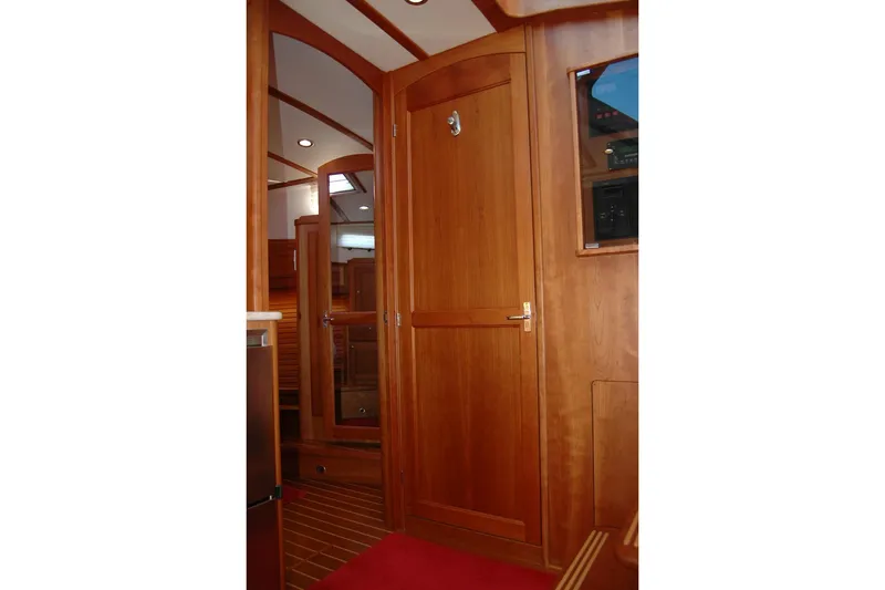 Slide: The Image of 2019 Sabre 38 Salon Express interior with wooden cabinetry and modern design. - 82