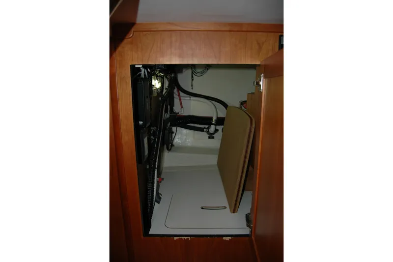 Slide: The Image of 2019 Sabre 38 Salon Express interior storage compartment with wiring and equipment. - 83