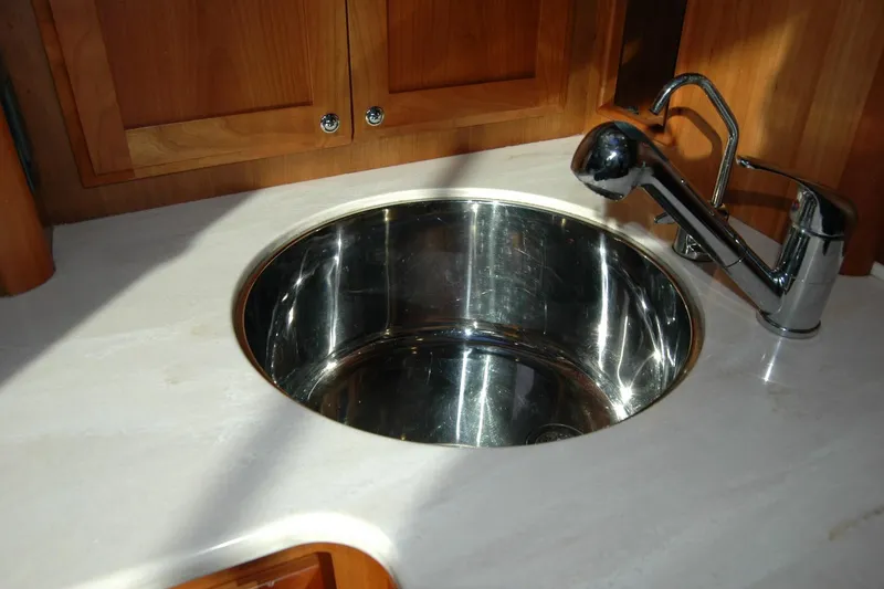 Slide: The Image of Stainless steel sink and faucet in 2019 Sabre 38 Salon Express yacht kitchen. - 90