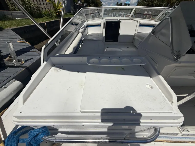 Slide: The Image of 2000 Contender 35 Side Console boat interior with seating and storage areas. - 20