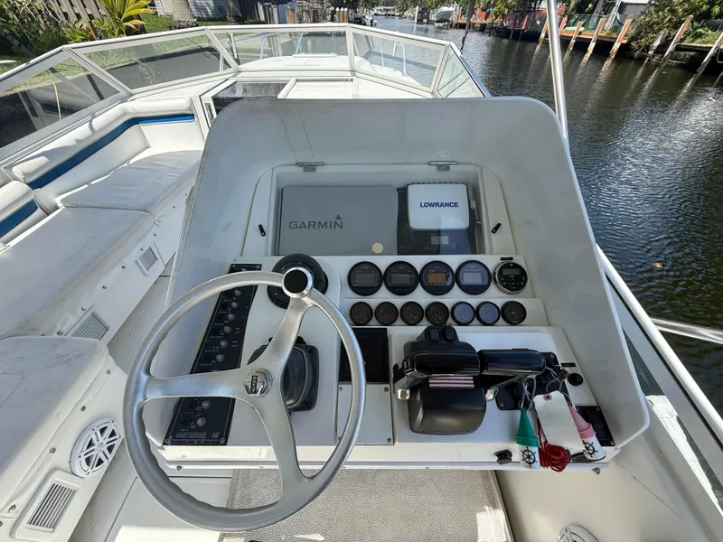 Slide: The Image of Console of a 2000 Contender 35 Side Console boat with Garmin and Lowrance equipment. - 27