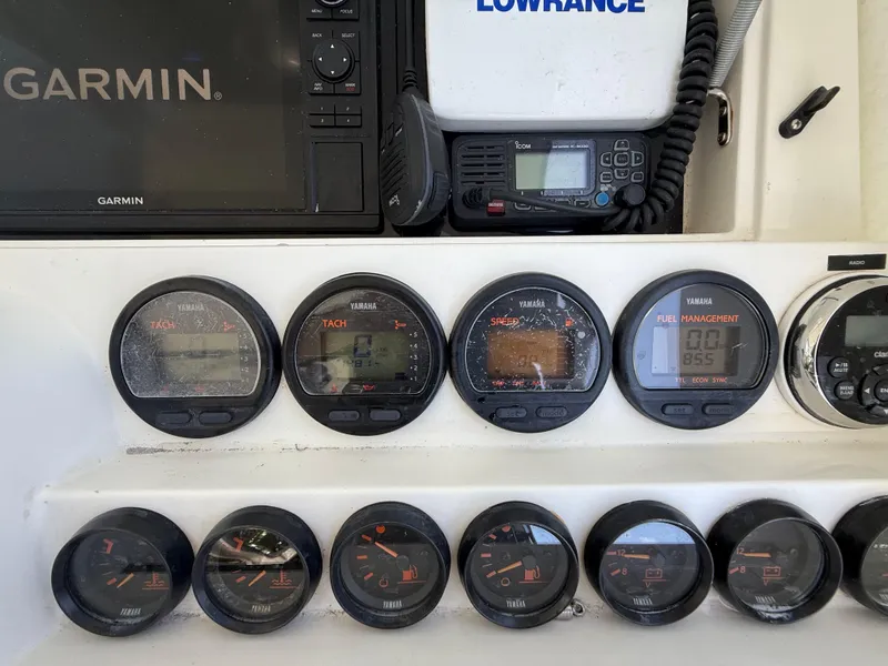 Slide: The Image of Console of 2000 Contender 35 Side Console with Yamaha gauges and Garmin navigation. - 29