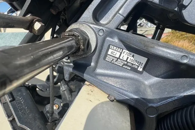 Slide: The Image of Close-up of a Yamaha F70LA engine on a 1973 Boston Whaler 17 Montauk boat. - 5