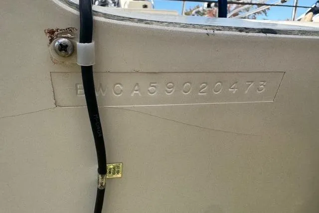 Slide: The Image of 1973 Boston Whaler 17 Montauk hull identification number on boat exterior. - 9