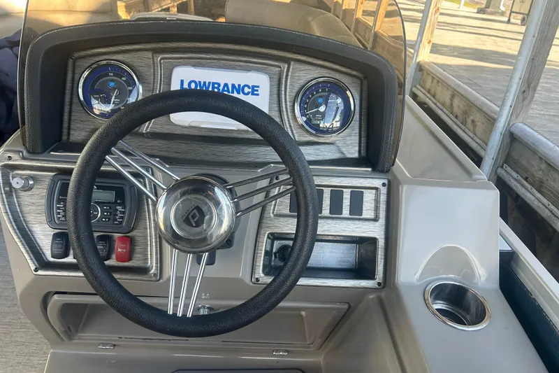 Slide: The Image of 2019 Premier 240 SunSation pontoon boat on concrete surface, showing metal pontoon detail. - 12