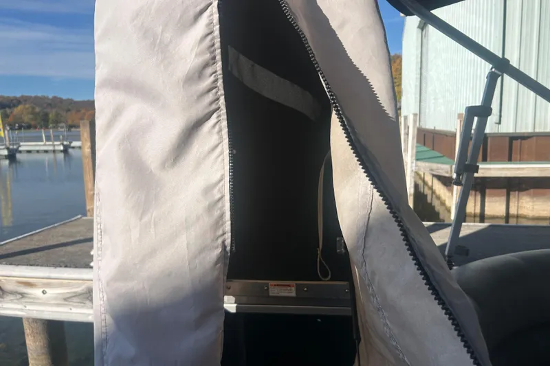 Slide: The Image of 2019 Premier 240 SunSation boat interior with gray seating and round table. - 22