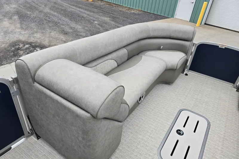 Slide: The Image of 2019 Premier 240 SunSation pontoon boat with gray seating and spacious deck area. - 28