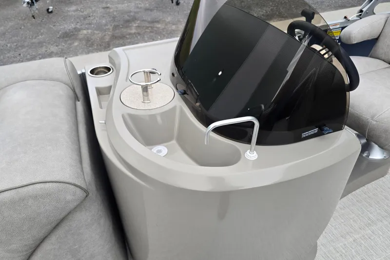 Slide: The Image of 2019 Premier 240 SunSation boat console with cup holders and steering wheel. - 30