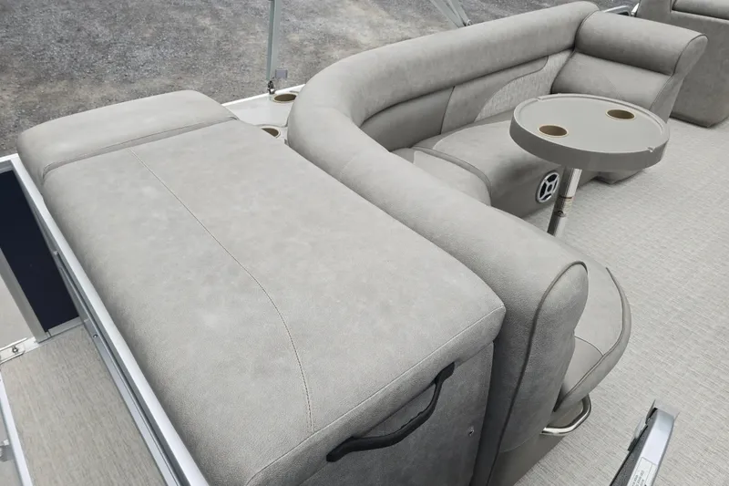 Slide: The Image of 2019 Premier 240 SunSation boat interior with gray seating and cup holders. - 34