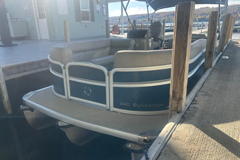 Slide: The Image of Close-up of 2019 Premier 240 SunSation boat exterior with logo detail. - 8