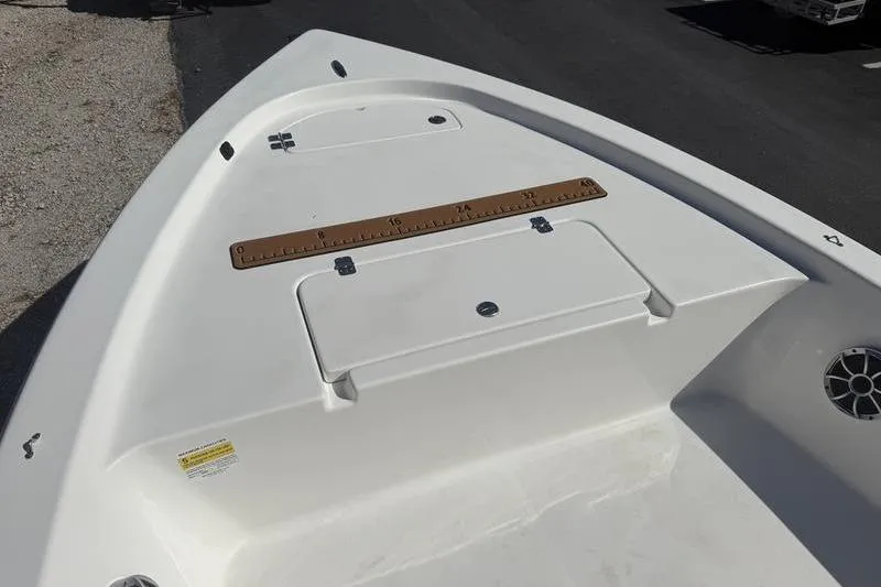 Slide: The Image of 2021 Sea Pro 172 Bay boat deck with storage compartment and measuring ruler. - 3