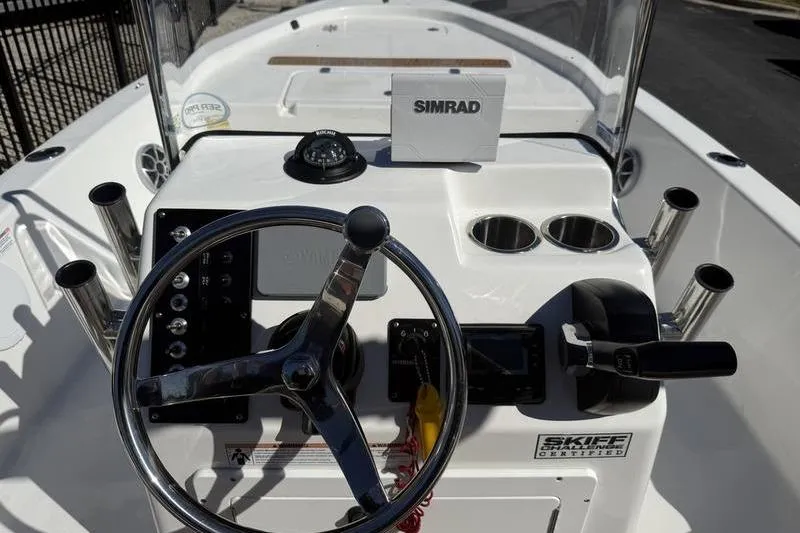 Slide: The Image of 2021 Sea Pro 172 Bay boat dashboard with steering wheel and Simrad navigation system. - 7