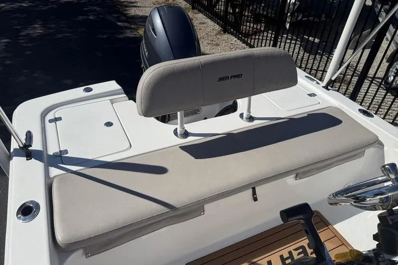 Slide: The Image of 2021 Sea Pro 172 Bay boat with cushioned seating and outboard motor. - 9