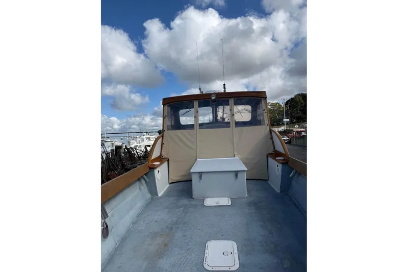 Slide: The Image of 1980 GROVER BUILT 26 Diesel boat deck with clear sky and clouds. - 4