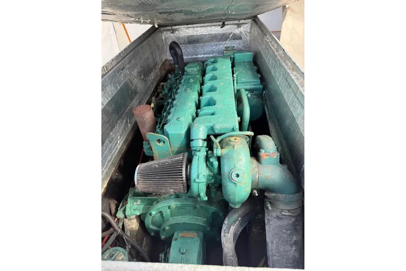 Slide: The Image of 1980 GROVER BUILT 26 Diesel engine, green, in a metal enclosure. - 5