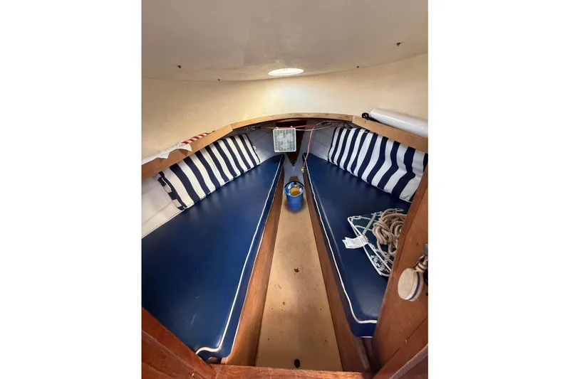 Slide: The Image of Interior of 1980 GROVER BUILT 26 Diesel boat with blue and white striped cushions. - 8