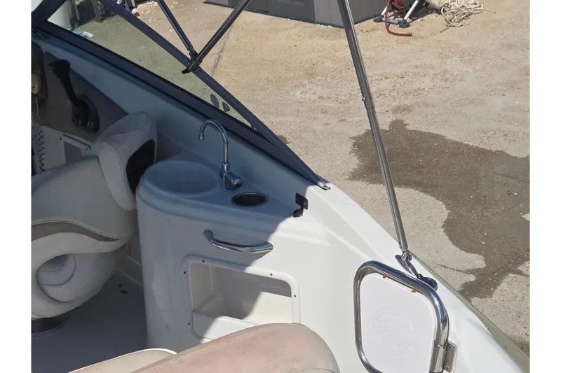 Slide: The Image of 2007 Crownline 220 LS boat interior with sink and seating area. - 13