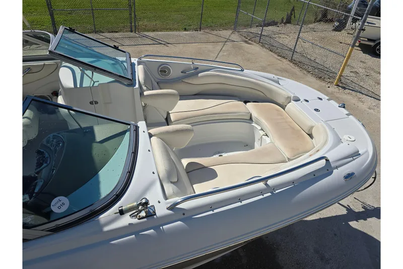 Slide: The Image of 2007 Crownline 220 LS boat interior with beige seating and open windshield. - 4