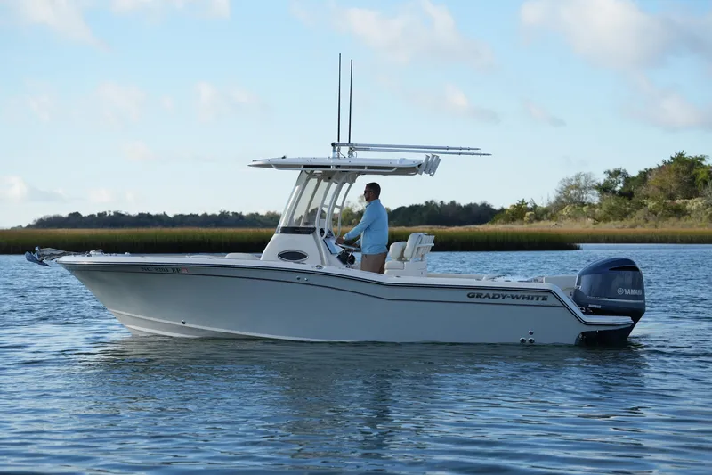 Slide: The Image of 2020 Grady-White Fisherman 236 boat on calm water with scenic background. - 13