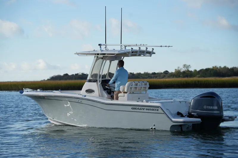 Slide: The Image of 2020 Grady-White Fisherman 236 boat cruising on calm water with Yamaha engine. - 14