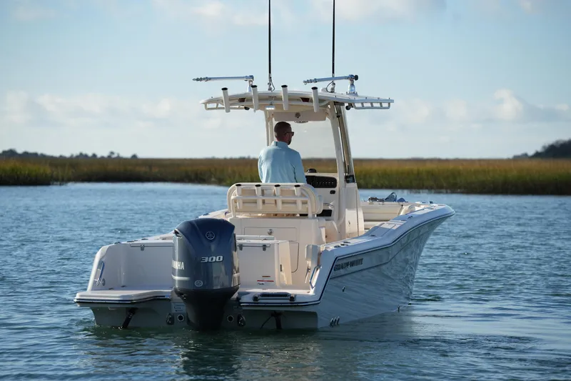 Slide: The Image of 2020 Grady-White Fisherman 236 boat on water, rear view with Yamaha 300 engine. - 17