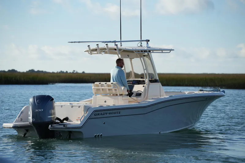 Slide: The Image of 2020 Grady-White Fisherman 236 boat cruising on calm water. - 18