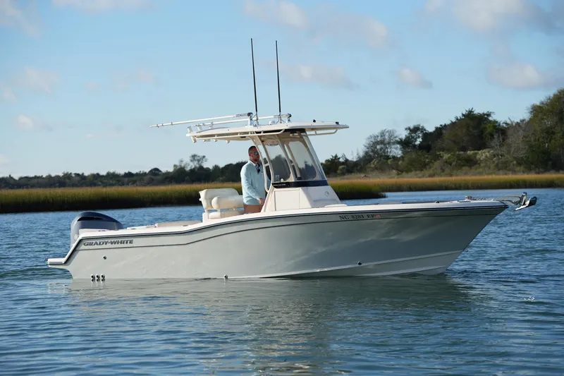 Slide: The Image of 2020 Grady-White Fisherman 236 boat on calm water, side view. - 2