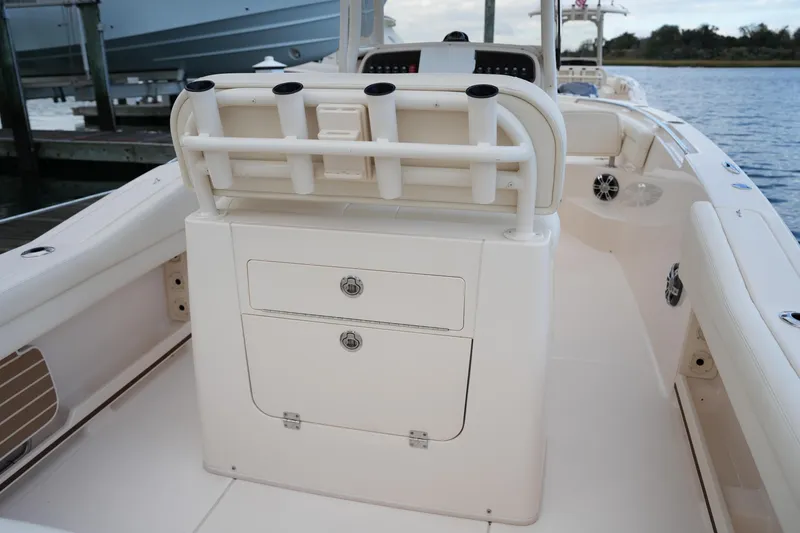 Slide: The Image of 2020 Grady-White Fisherman 236 boat interior with rod holders and storage compartments. - 22